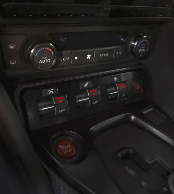 Nissan GT-R detail view of ventilation controls with aluminum bezels.
