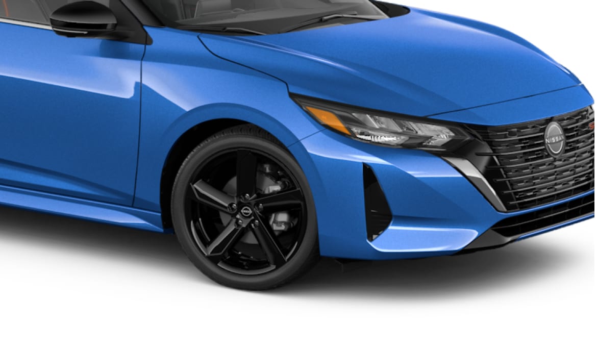 Side view of blue 2024 Nissan Sentra aluminum alloy wheels