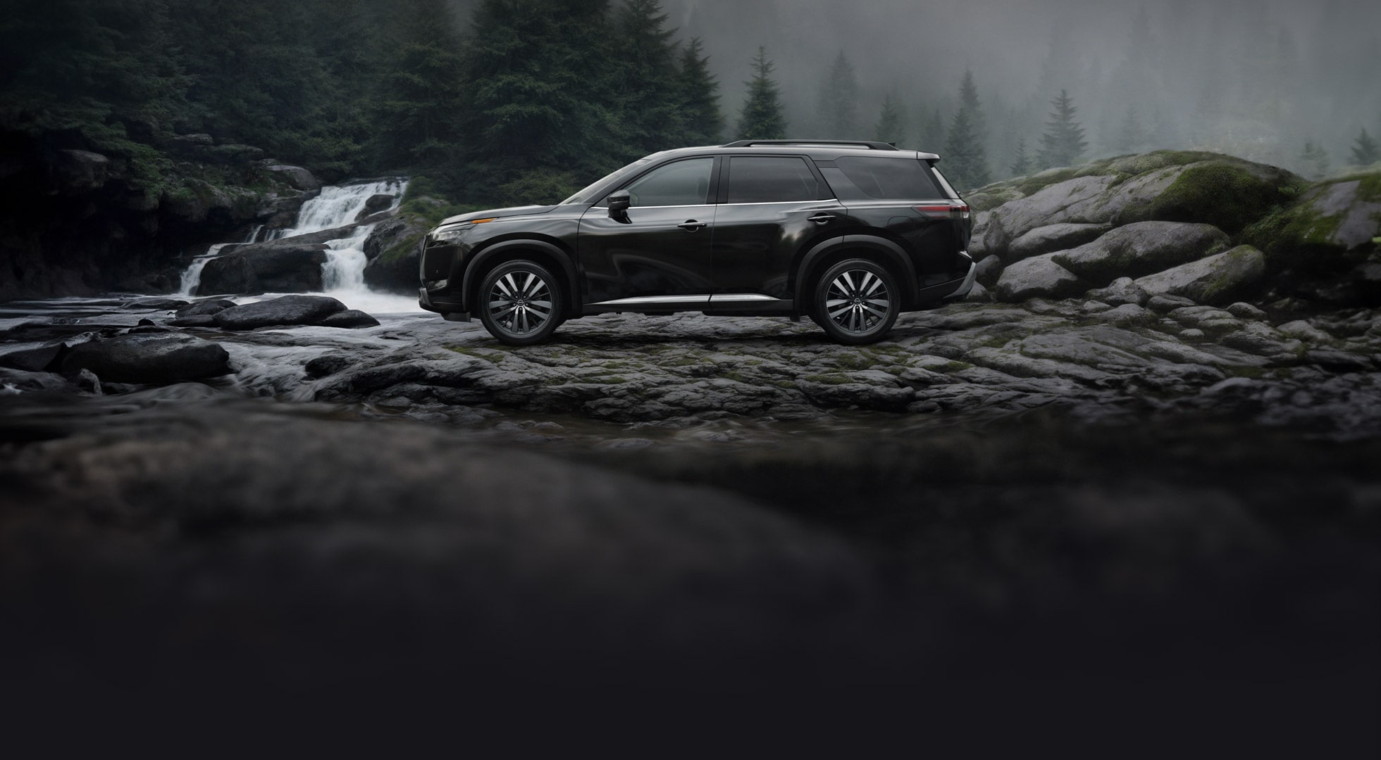 side view of Nissan Pathfinder on a rocky terrain