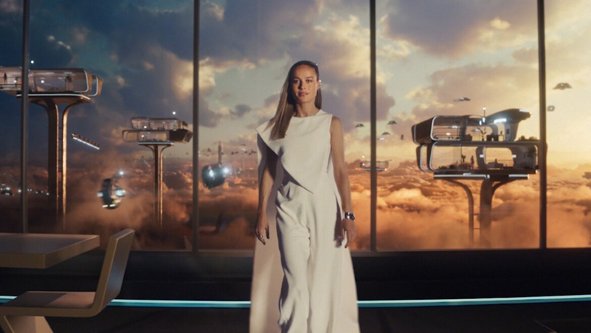 Brie Larson in futuristic earth living room.