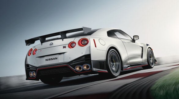 Rear view of a Nissan GT-R cornering on a race track