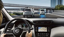 2022 Nissan Qashqai in Caspian Blue showing advanced Driver assist technology on the road