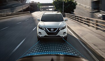2022 Nissan Qashqai on the road showing automatic emergency braking with pedestrian detection technology