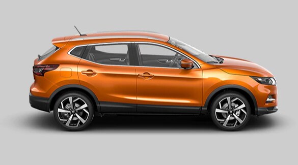 2022 Nissan Qashqai in Monarch Orange in profile with grey background