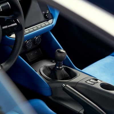 Gear shift and console of a 2024 Nissan Z with blue interior