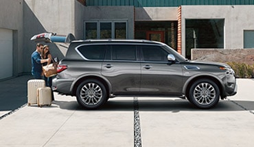 2022 Nissan Armada couple loading in cargo to illustrate power liftgate