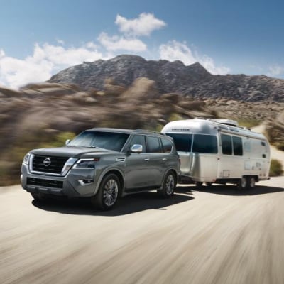 2024 Nissan Armada towing a trailer off-road