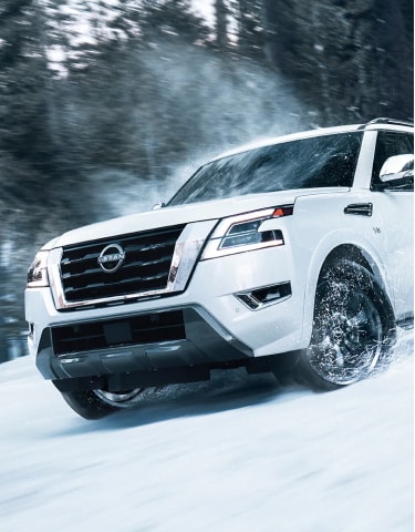 Front view of 2024 Nissan Armada driving through the snow