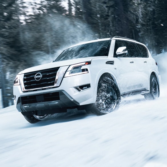 2024 Nissan Armada descending a snowy hill to illustrate intelligent 4x4 capability