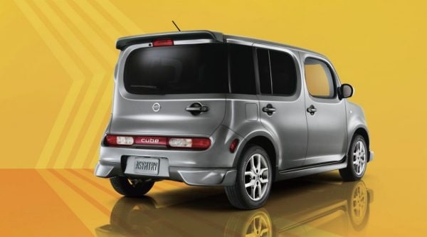 Rear view of Nissan Cube on yellow background