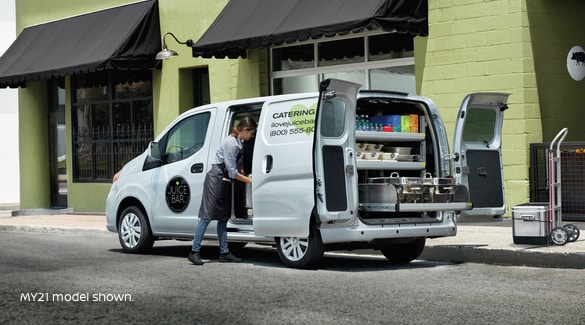 Woman working from Nissan NV200 Compact Cargo van