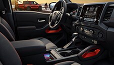 2022 Nissan Frontier interior showing front seats and cockpit. 