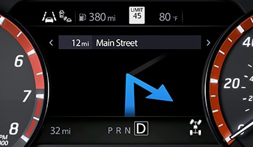 2023 Nissan Frontier gauge screen showing turn-by-turn navigation.