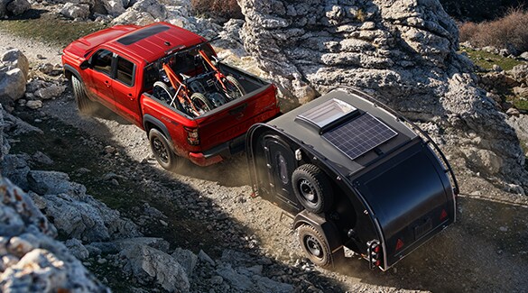 2023 Nissan Frontier towing a trailer off-road