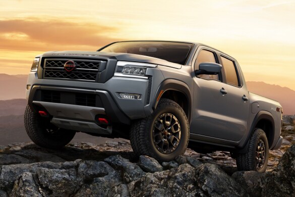 2023 Nissan Frontier on rocky outcrop in the mountains.
