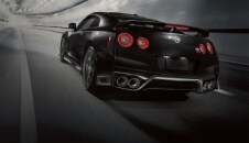 2023 Nissan GT-R rear view driving through well-lit tunnel.