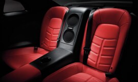Nissan GT-R interior showing seats and subwoofer system for Bose Premium Audio system.