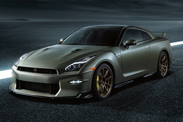 2024 Nissan GT-R in Bayside Blue on a gray background.