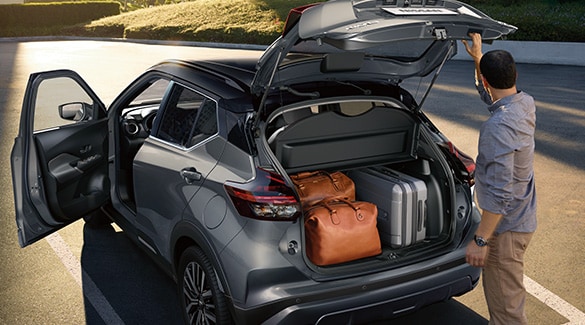 2023 Nissan Kicks view of hatch open and cargo area with luggage