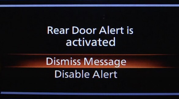 2023 Nissan Kicks gauge display showing rear door alert message