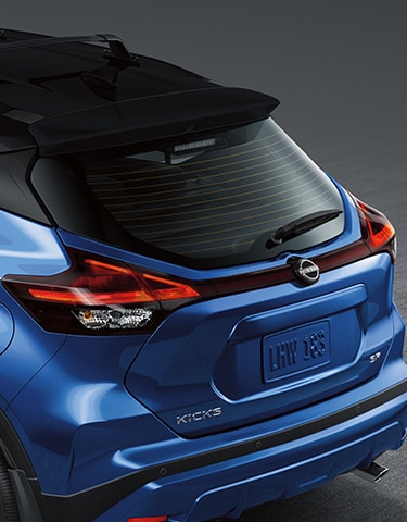 2024 Nissan Kicks in blue rear end view of LED taillights