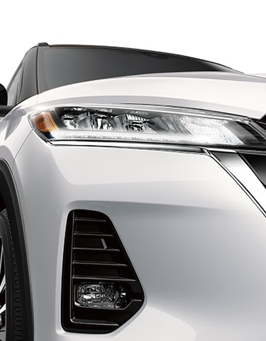 White 2024 Nissan Kicks front view of LED headlights