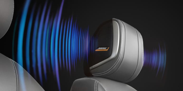 2024 Nissan Kicks front seat illustrating Bose Speakers in headrest