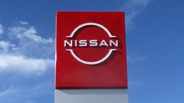 2023 Nissan LEAF red sign with Nissan logo