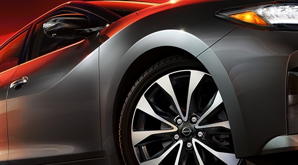 2023 Nissan Maxima front wheel to illustrate monotube shock suspension.