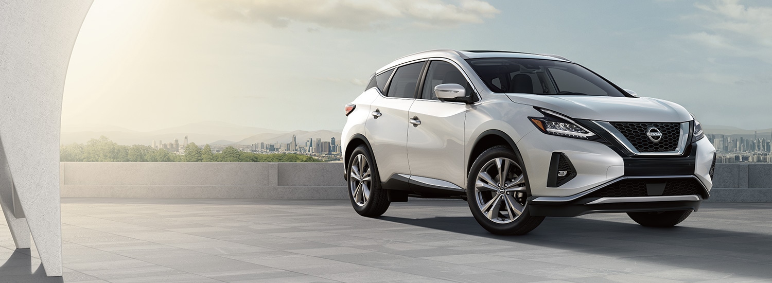 2023 Nissan Murano parked in plaza overlooking city and mountains.