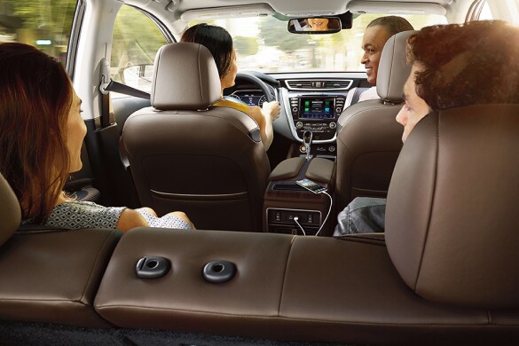 2023 Nissan Murano rear view of four people socializing in car.