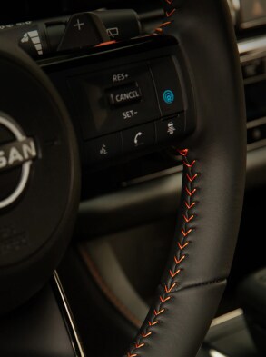 2023 Nissan Pathfinder Rock Creek model closeup of contrast stitching on steering wheel