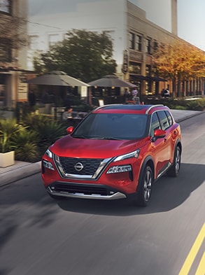 2023 Nissan Rogue in scarlet ember showing LED headlights.