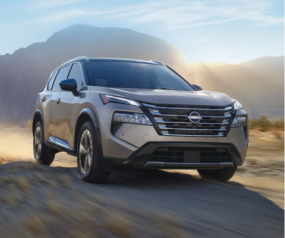 2024 Nissan Rogue Mid-size crossover SUV driving on a dirt track