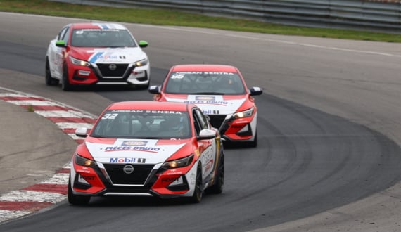 Nissan Sentra cup cars racing on a track