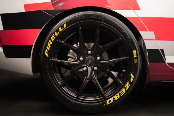 Closeup of Nissan Sentra wheel and brakes