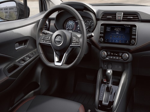 Interior view of 2024 Nissan Versa steering wheel and controls