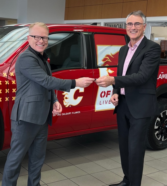 Calgary Flames representative receiving keys of branded partnership Nissan Frontier