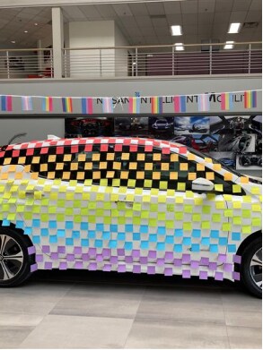 Nissan KICKS covered in sticky notes to create the pride flag as an art installation at the Nissan Headquarters