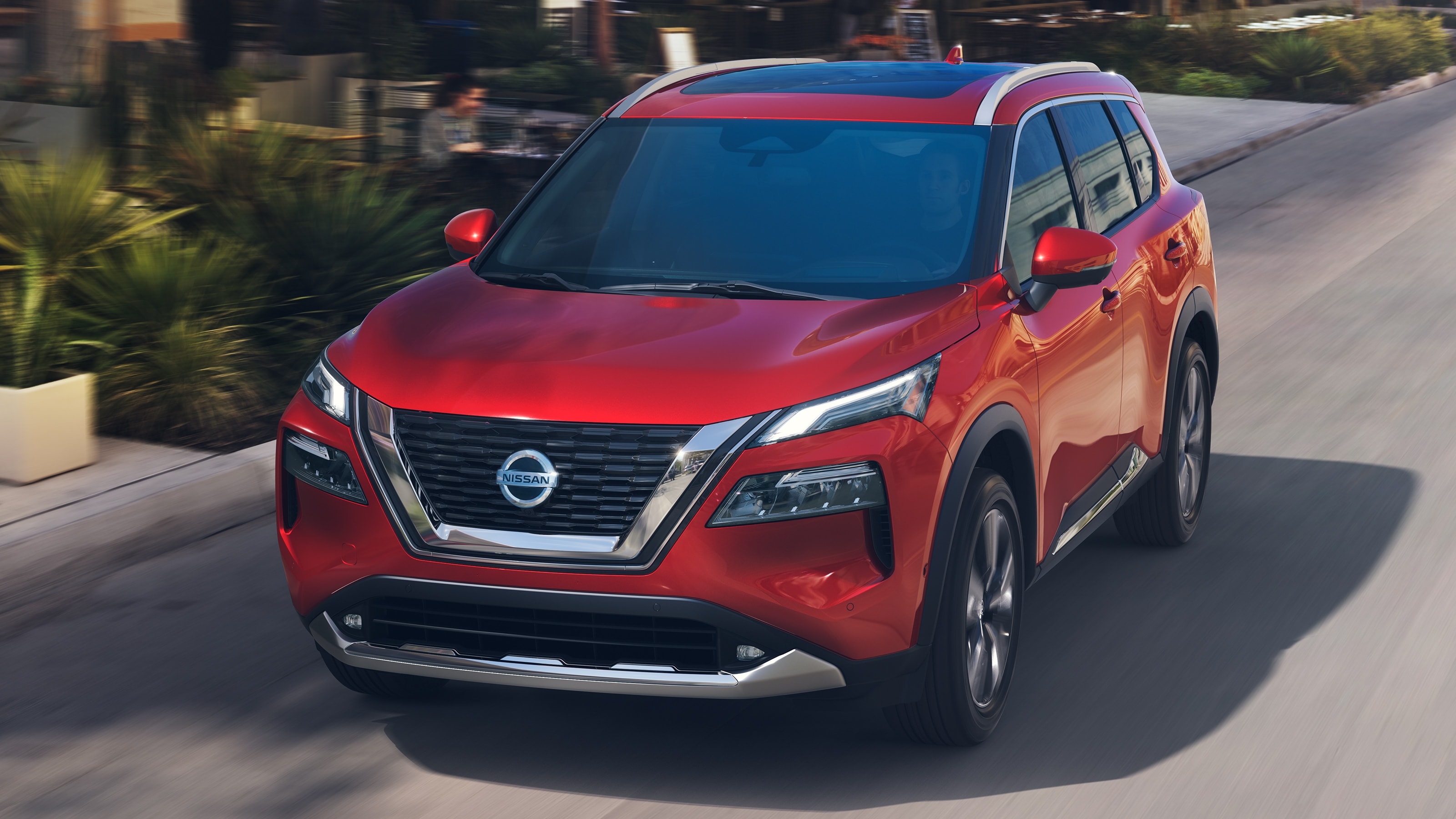 2021 Nissan Rogue exterior front driving in city