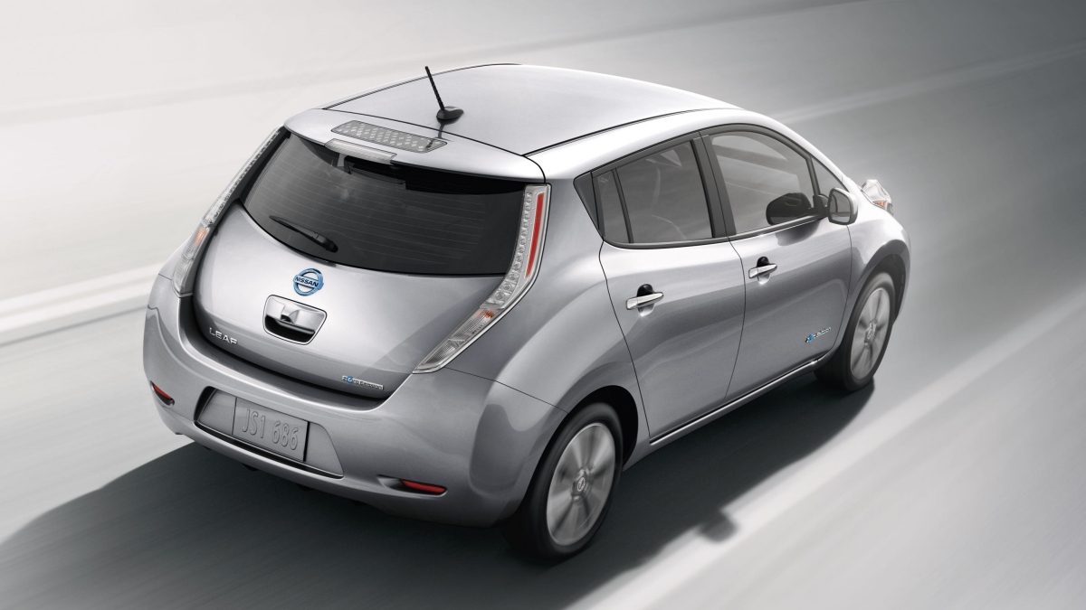 Nissan leaf in gun metallic coloured exterior driving fast on the road