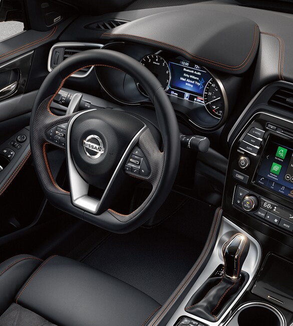 A top down view of the interior of the 2020 Nissan Altima with black leather and orange stitching accents