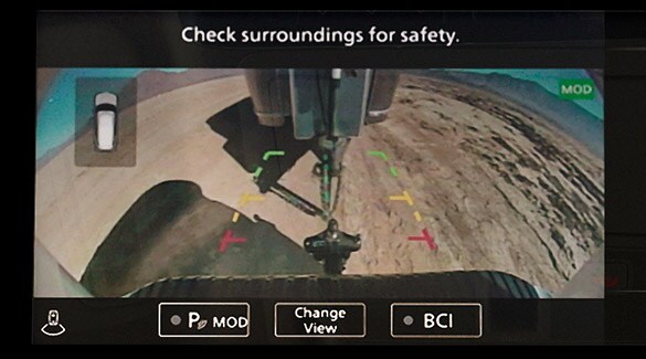 2023 Nissan Armada around view monitor camera showing guidelines lining vehicle and trailer hitch.