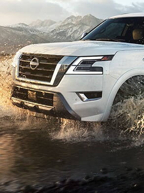 2023 Nissan Armada driving off-road to illustrate impressive ground clearance