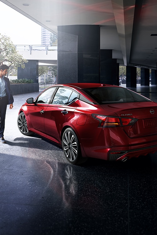 Angled rear view of red 2024 Nissan Altima