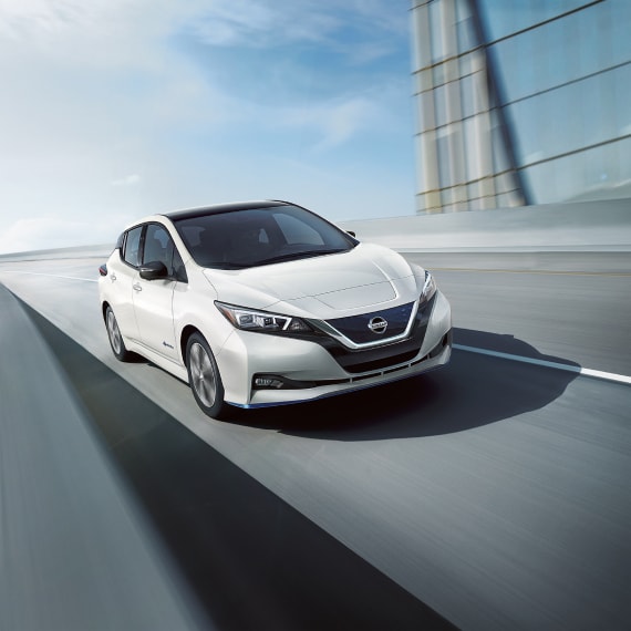 Nissan LEAF driving across city highway
